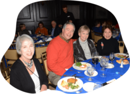 congregants seated at table for dinner event