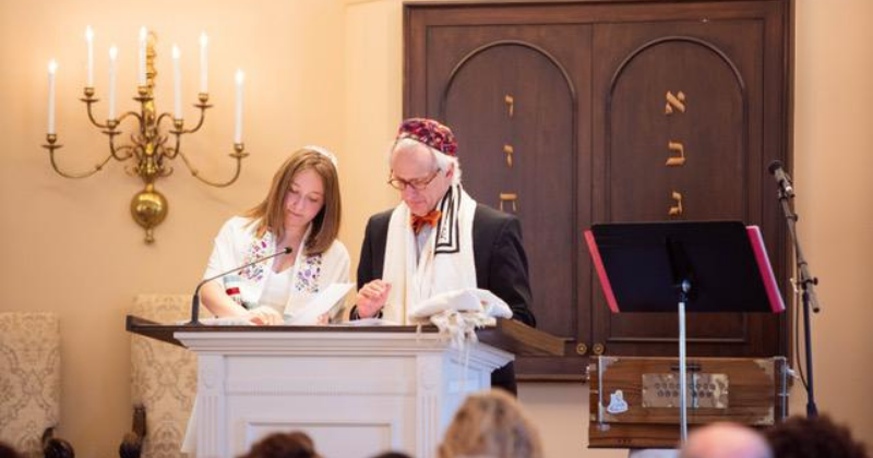 bat mitzvah reading from the torah with rabbi